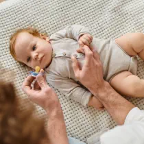 person teasing a baby