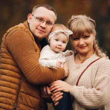 Family posing outdoors together