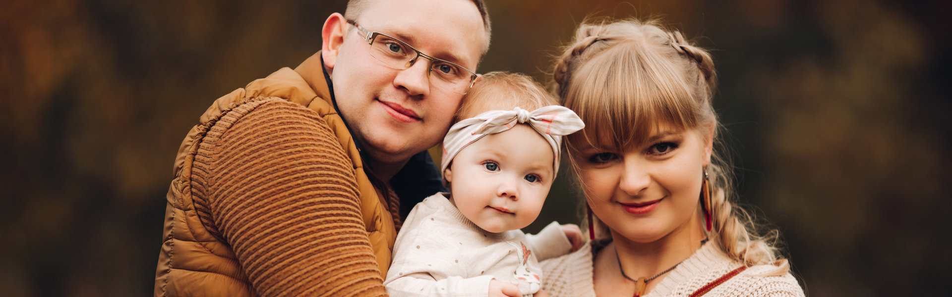 Family posing outdoors together