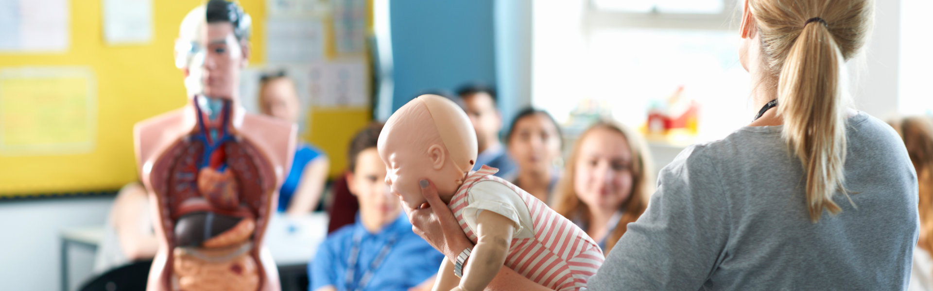 CPR instructor teaching infant rescue